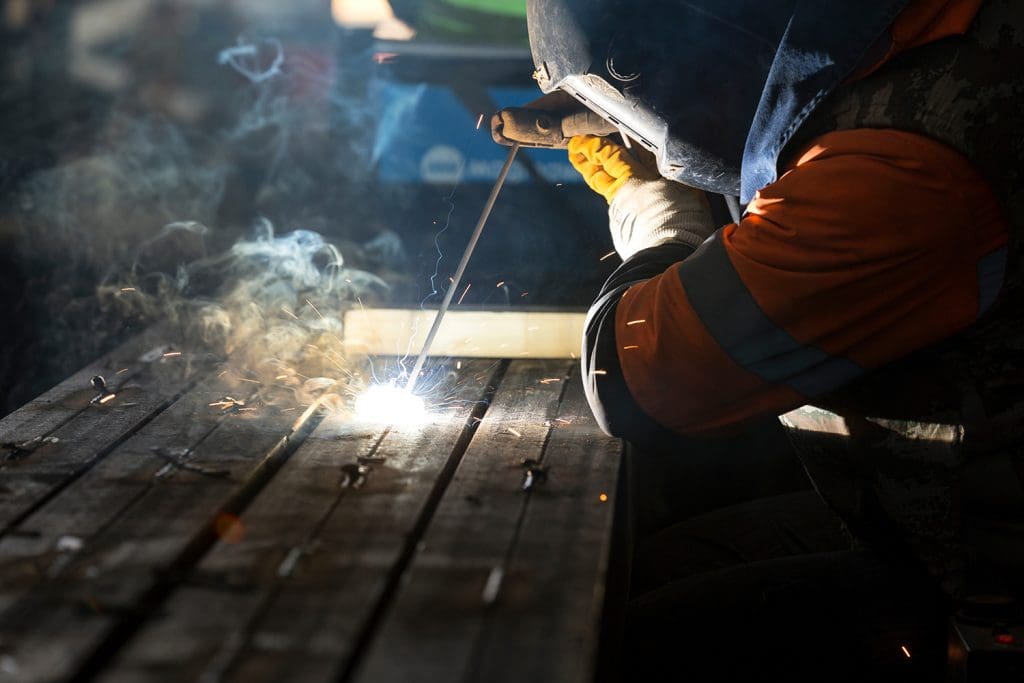 a person doing stick welding